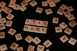 Scrabble pieces reading 'Stay Home' 